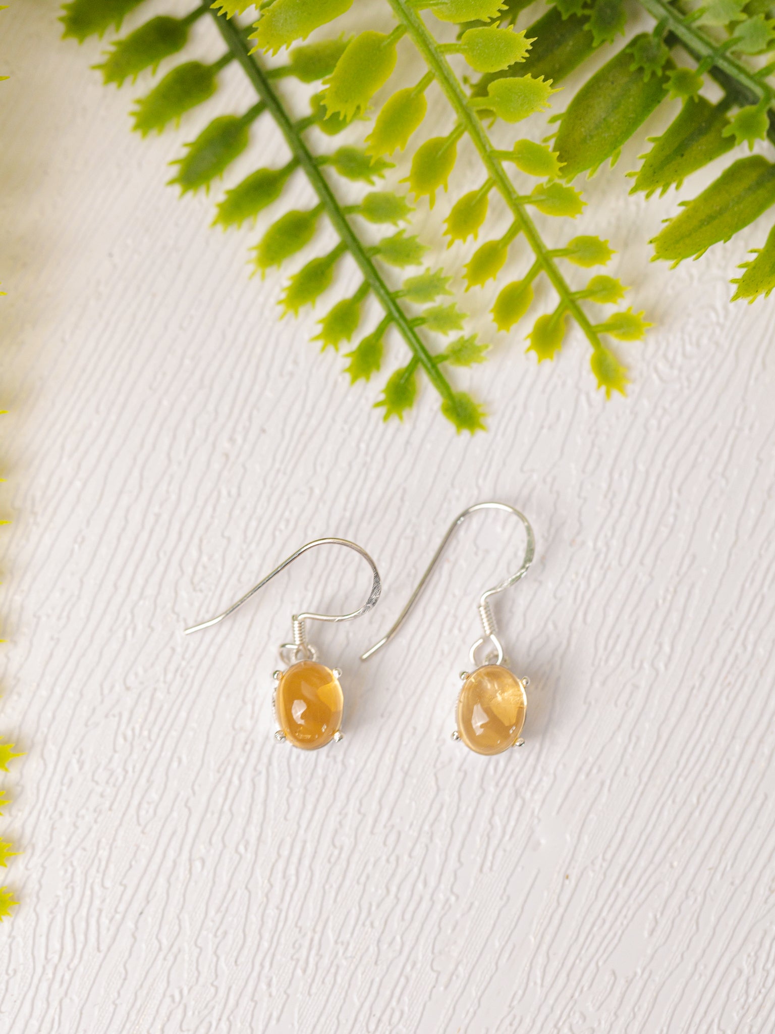 Zilveren citrien oorbellen rond